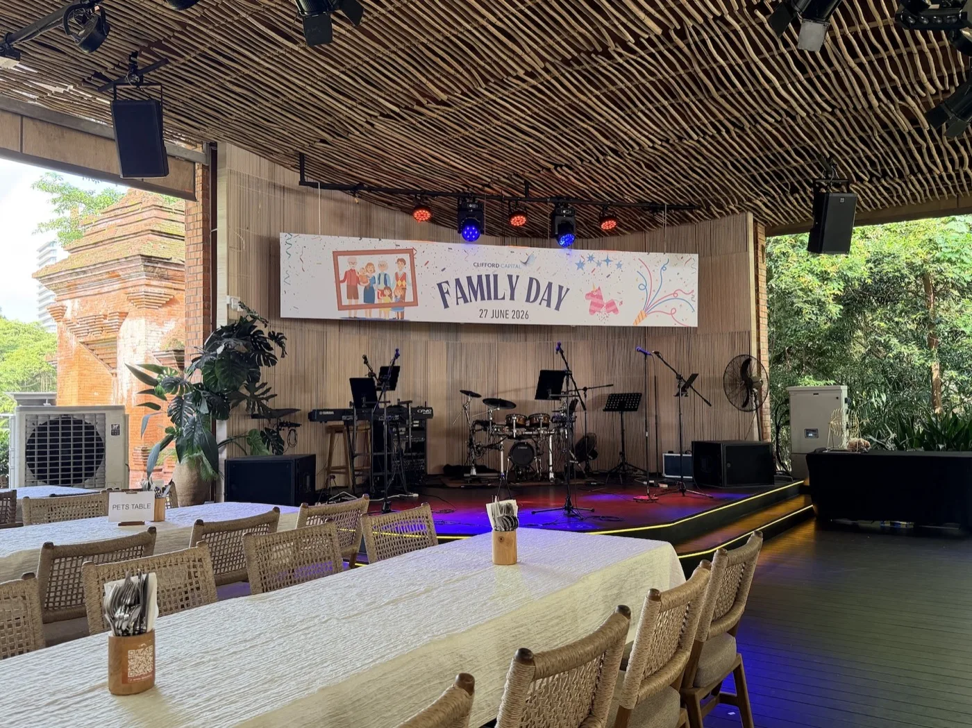 The Family Day stage backdrop hung at Wheeler's Tropikana, carrying the Clifford Capital mark and the 27 June 2026 date